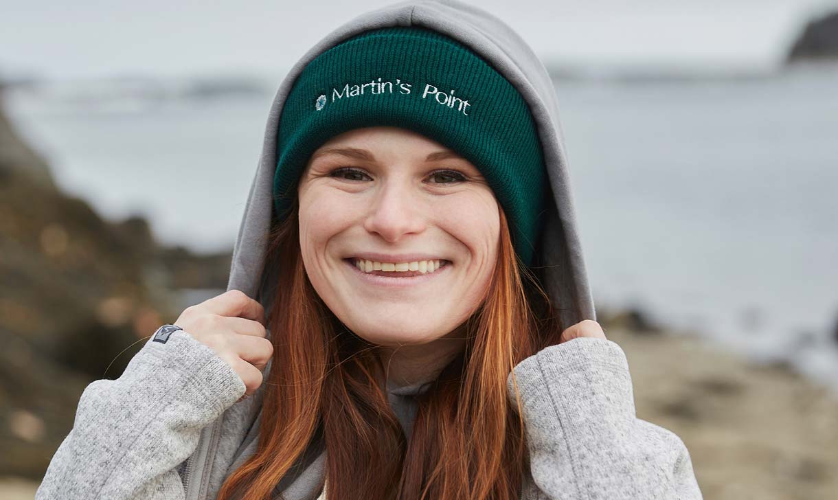 Young employee outside by the shore