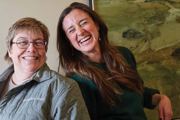 Employees laughing in an office