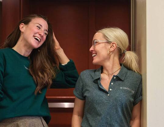 Two female employees talking