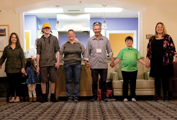 group of people holding hands