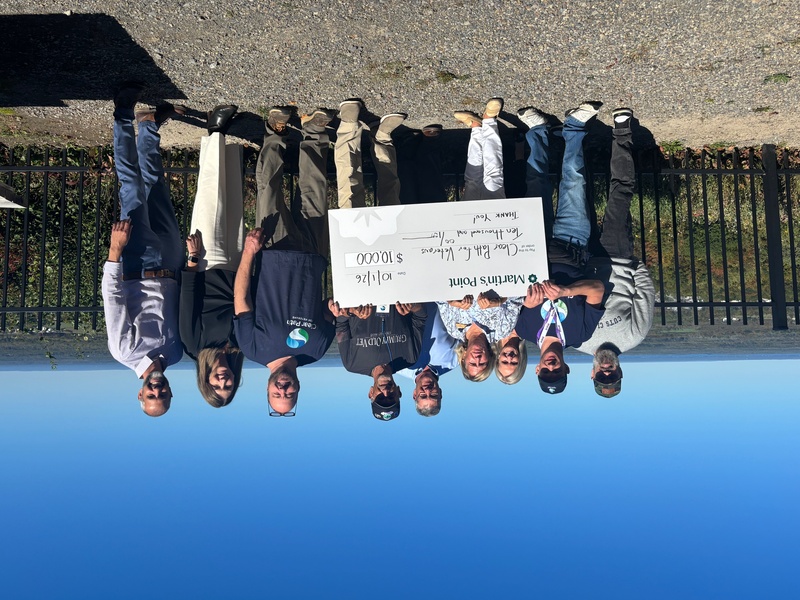 group holding a donation check