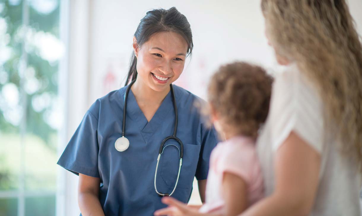 Nurse examining young child