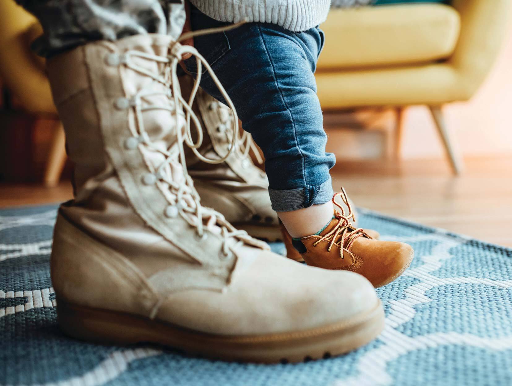 military boots with baby in front