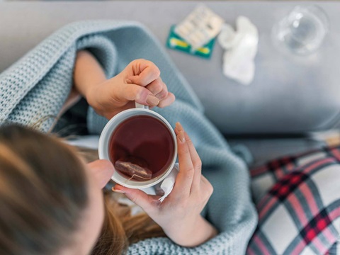 Female holding tea