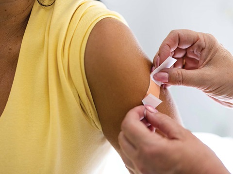 Patient getting band-aid 