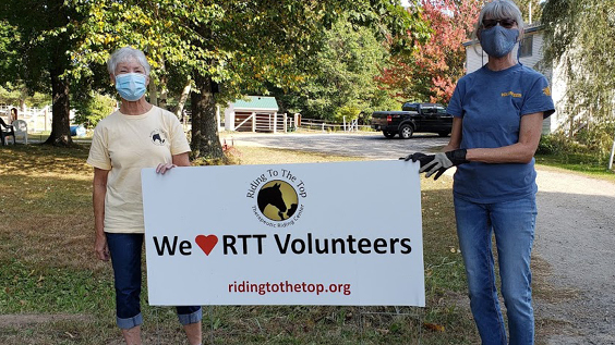 volunteers with sign