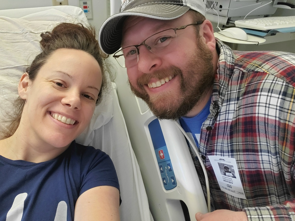 two people smiling in hospital room