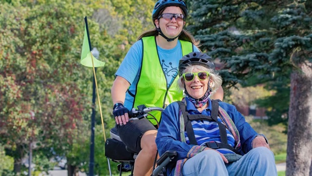 Portland wheelers biking elder woman smiling header without logo