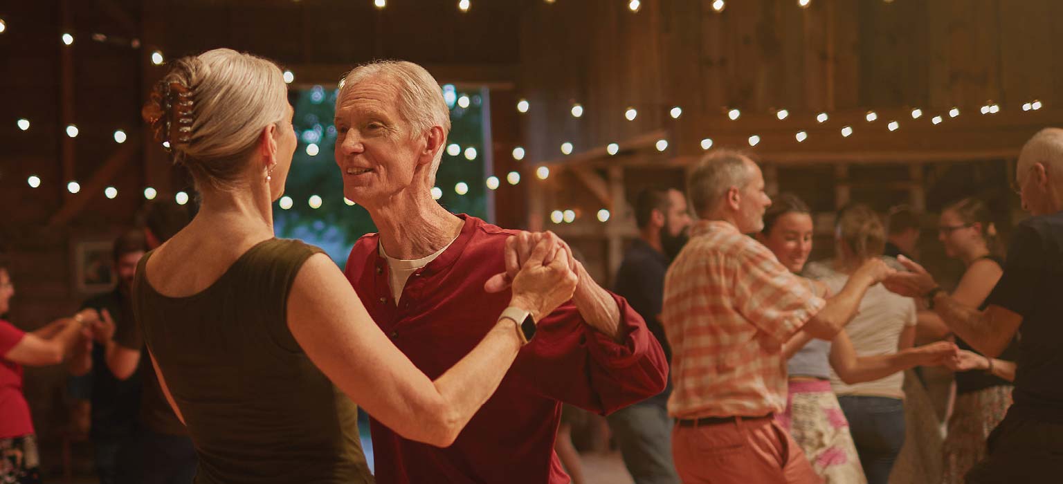 Smiling elderly couple dancing