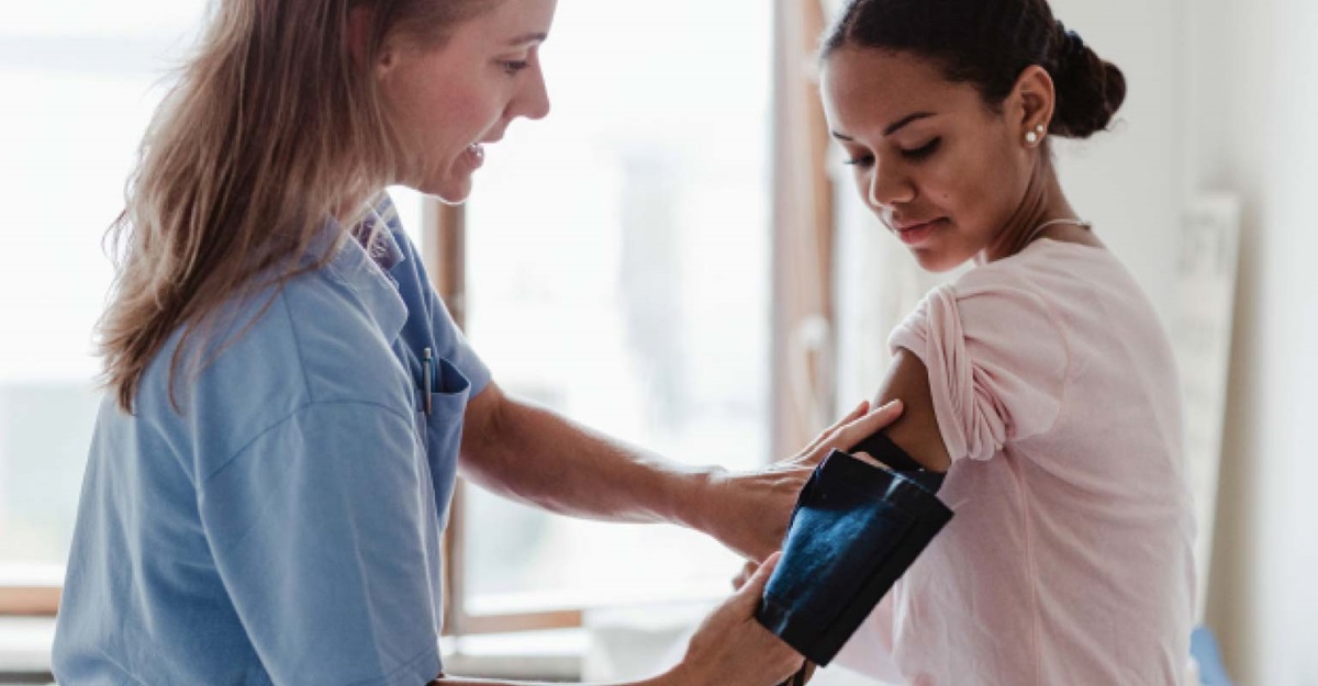 patient getting blood pressure taken lead image