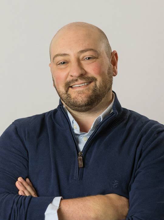 Lon Cameron, PAQ-C at Martin's Point Health Care Brunswick location, smiling and posing with arms crossed in a professional portrait.