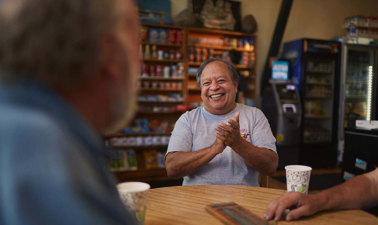 man at restaurant with friends
