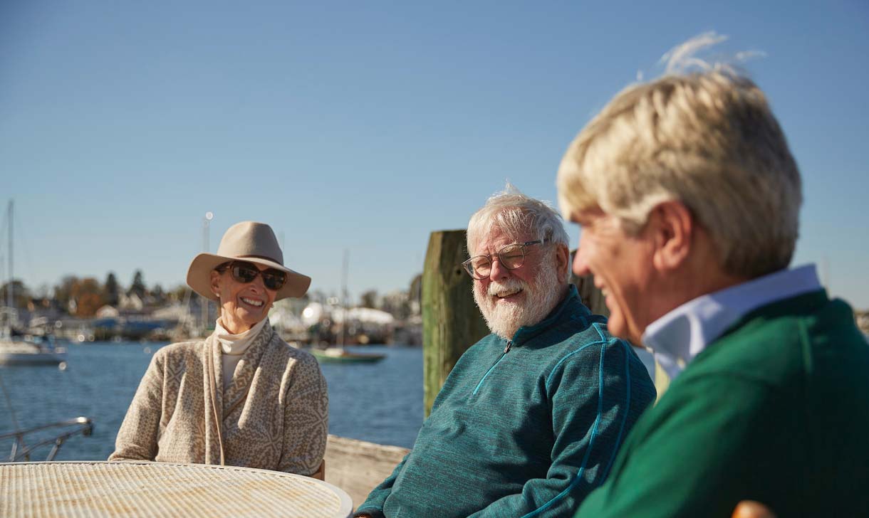 seniors sitting outside at harbor