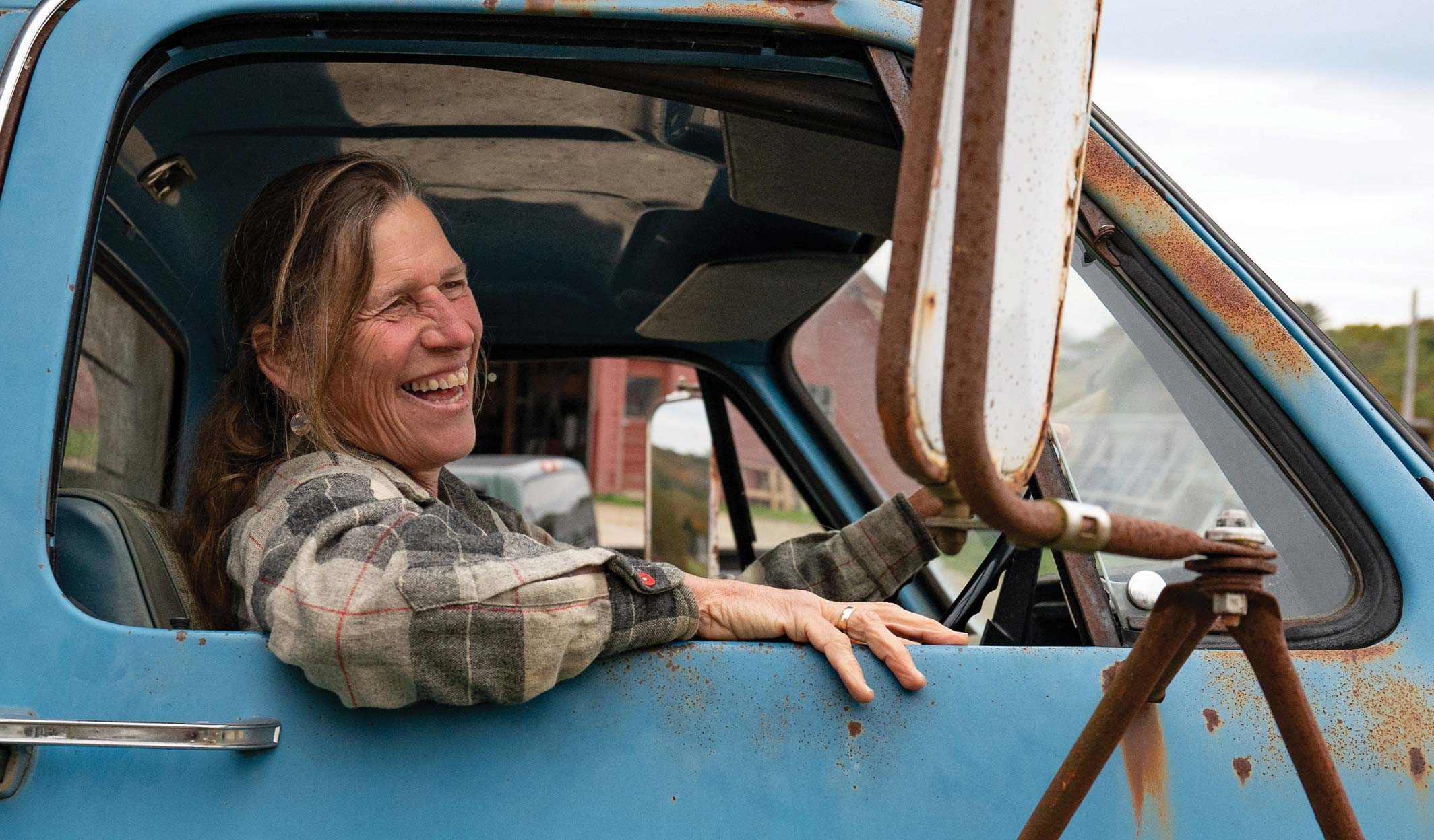 woman in a farm truck