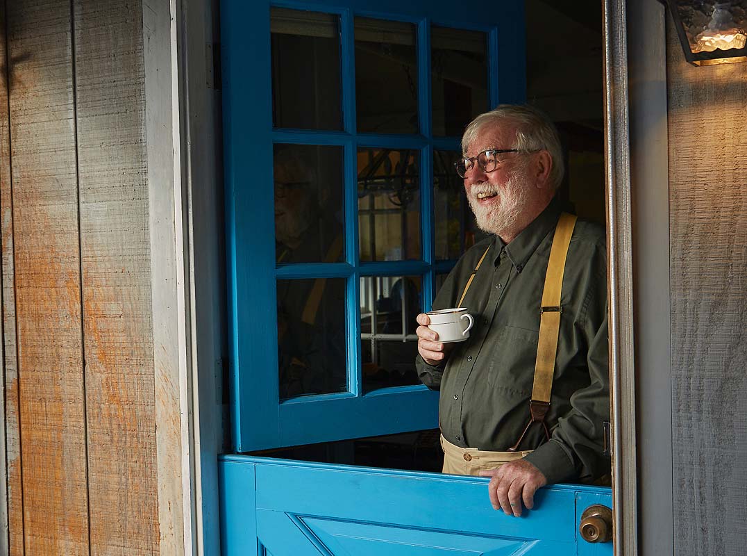 senior man having coffee at his seaside home