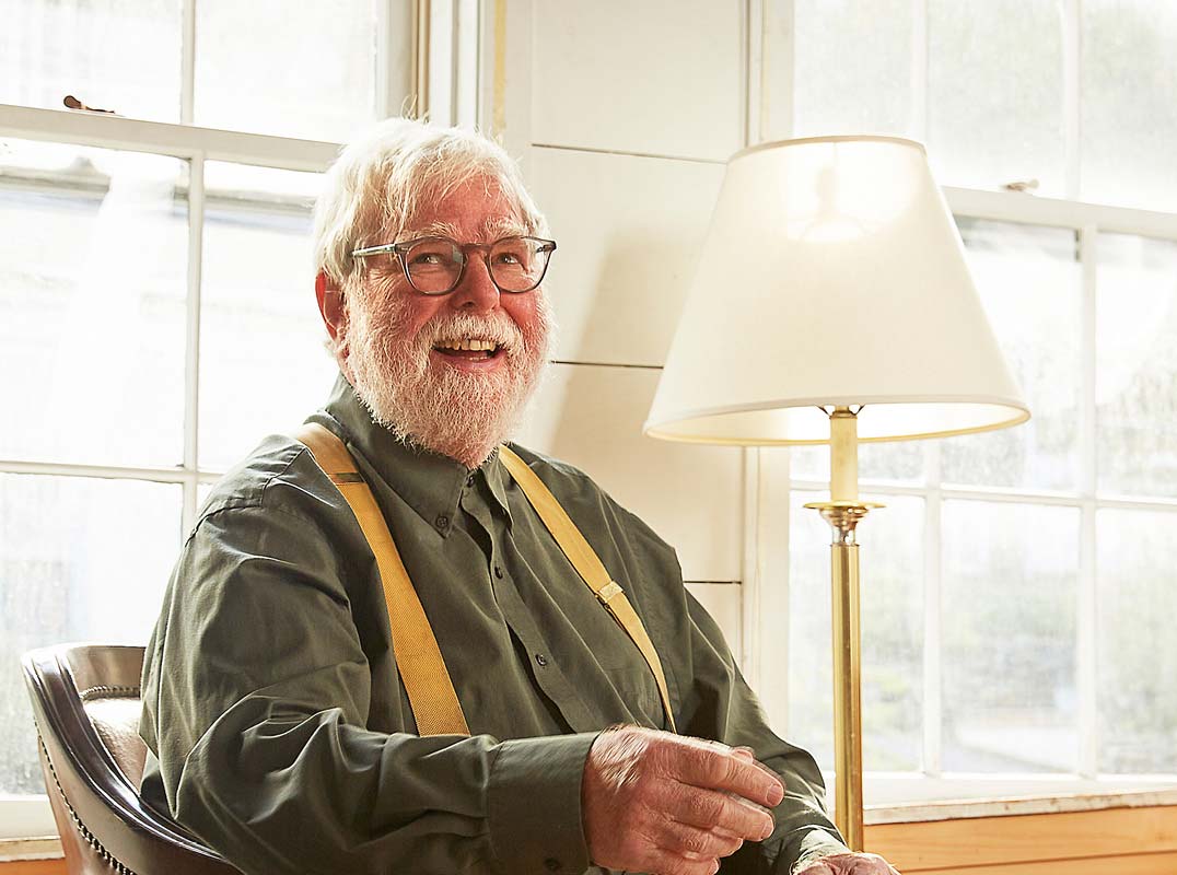 senior man at home in seaside cottage