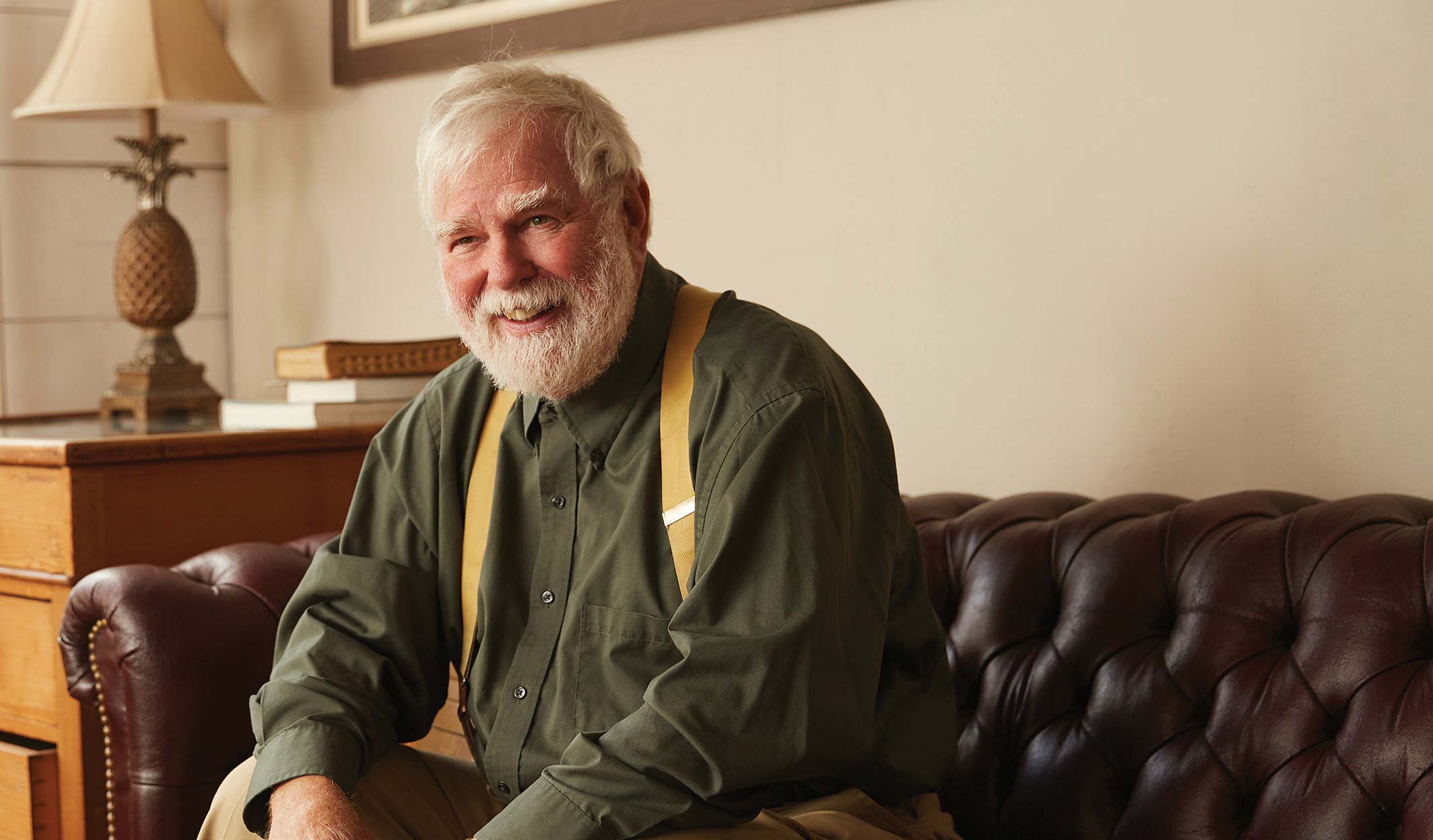 senior man sitting on sofa