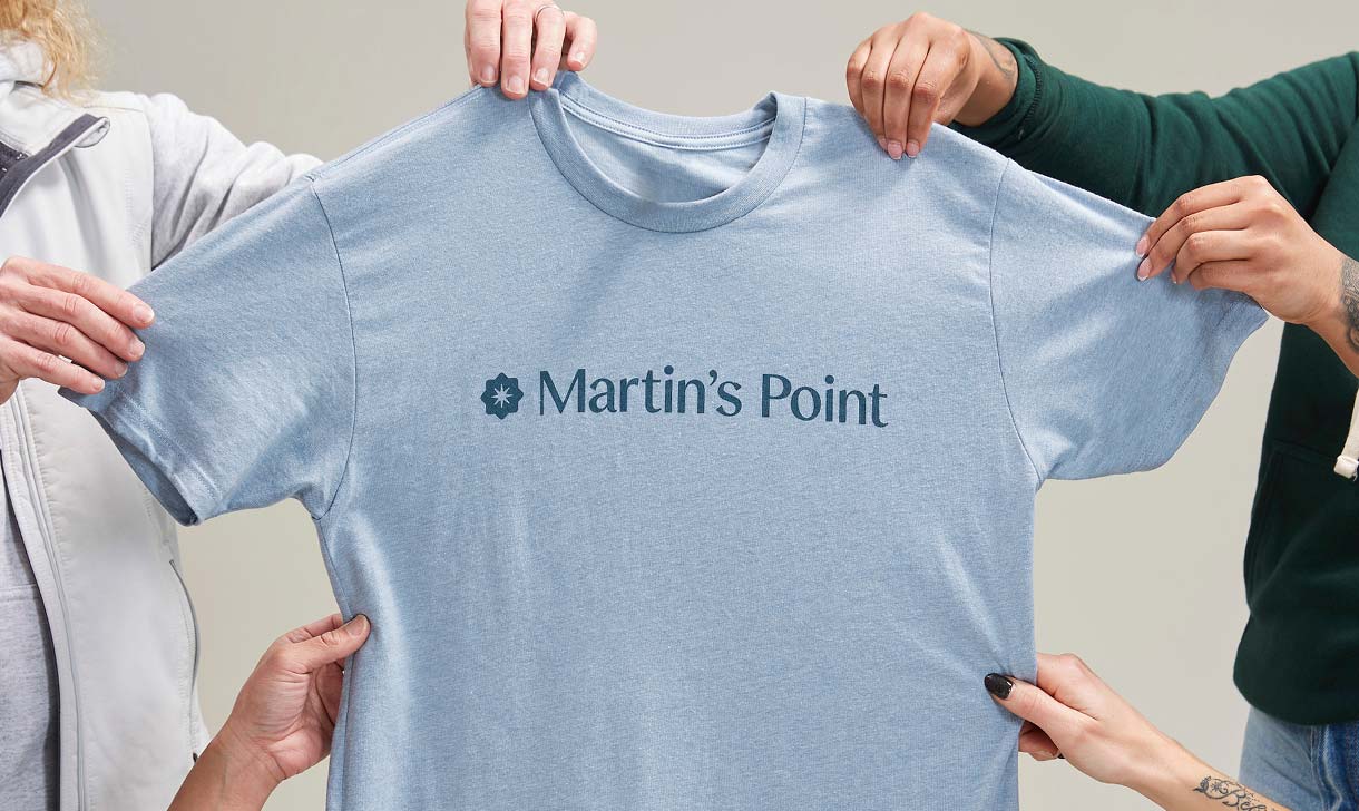 Martin's Point tshirt held by employees