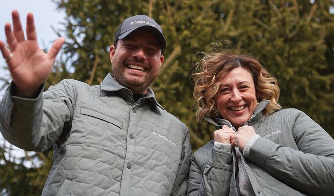 Employees waving at camera
