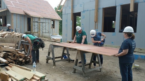 volunteers working on a home