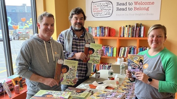 volunteers with books