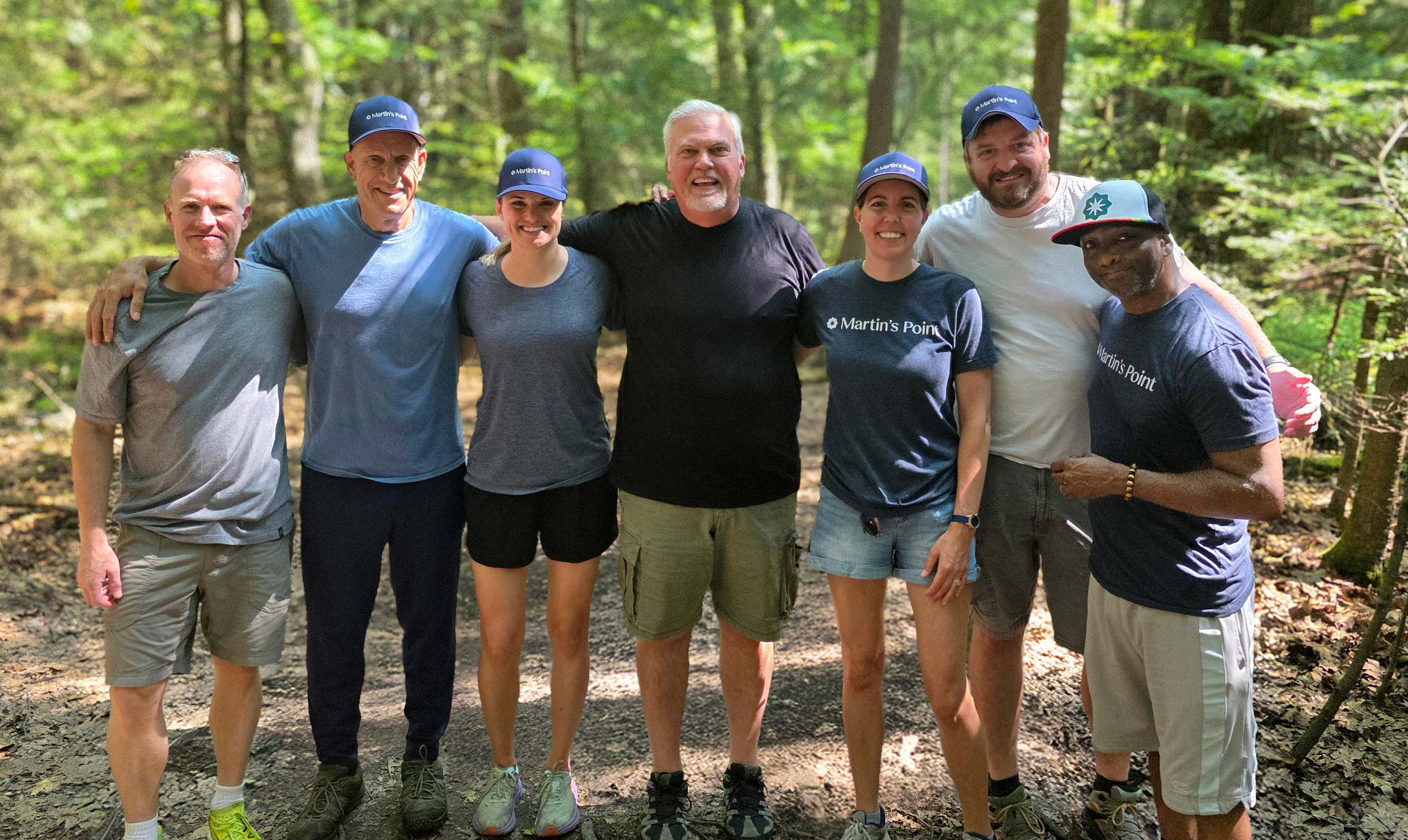 group posing on a trail