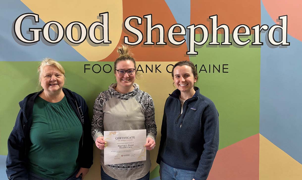 volunteers in front of a food bank