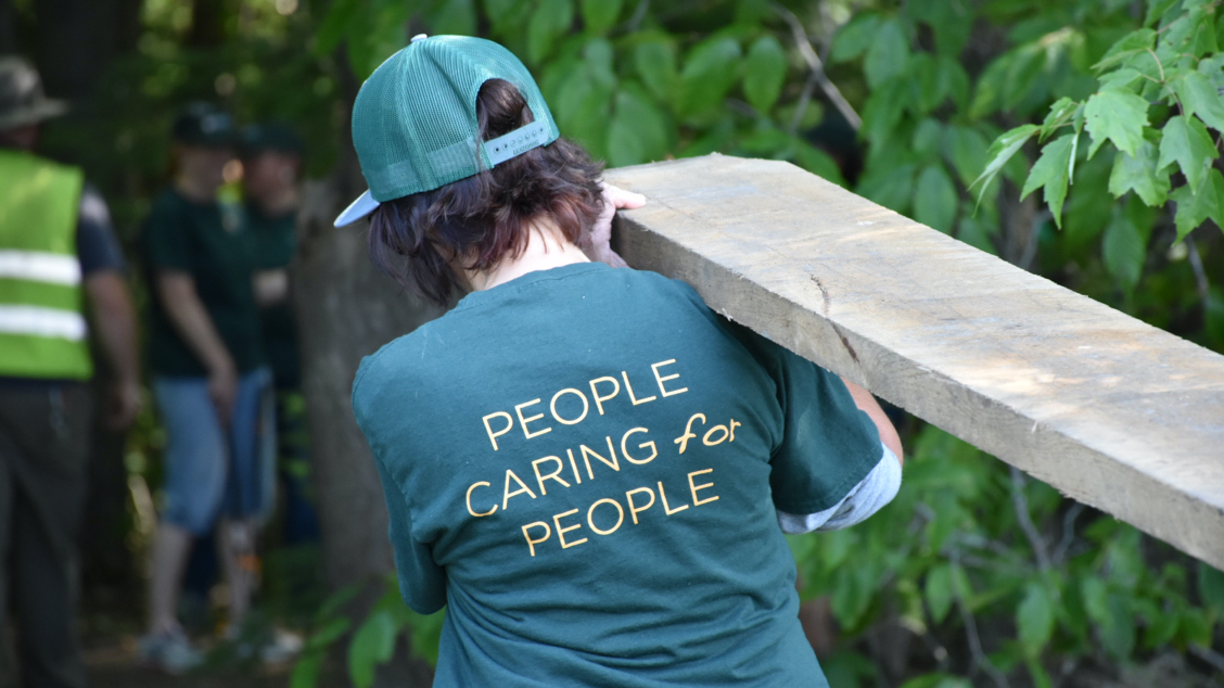 Person carrying lumber 