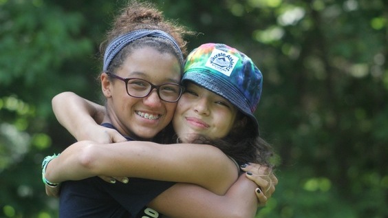 kids smiling and hugging