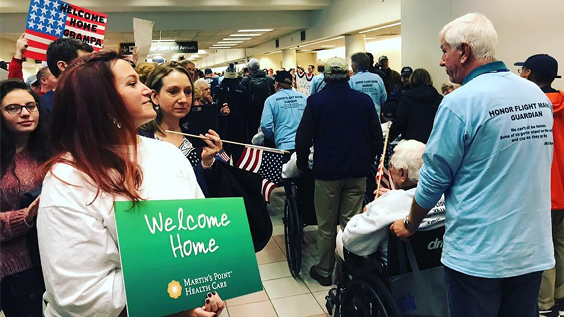 Seniors coming home from Honor Flight Maine.