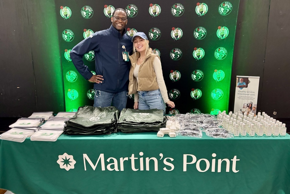 Martin's Point representative with Maine Celtics player