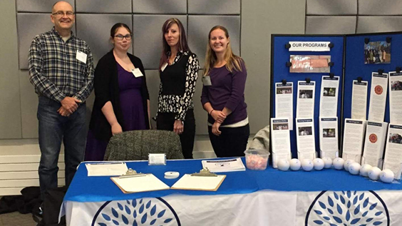 Milestone recovery employees at a fair