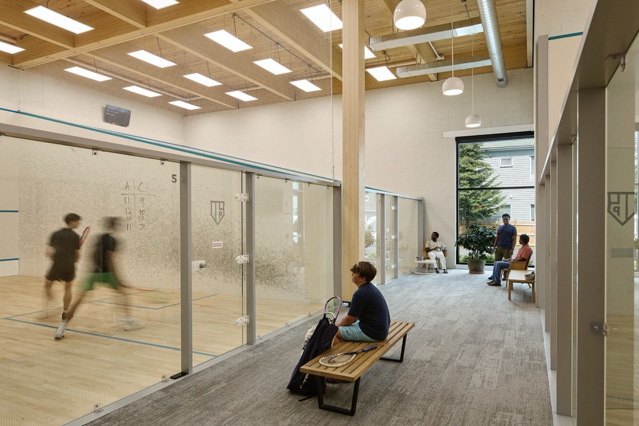people playing on squash courts