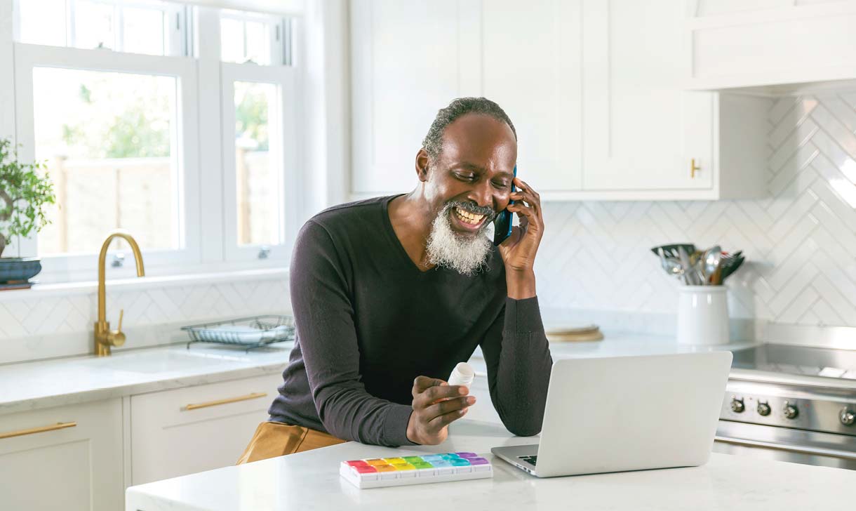 Man on phone with prescriptions
