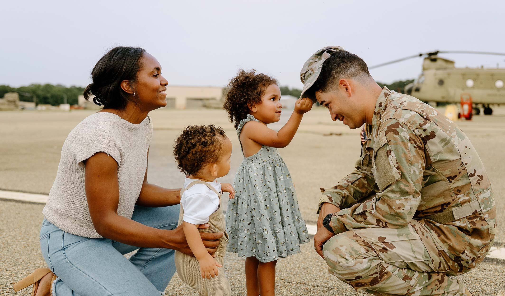 family reuniting with military father