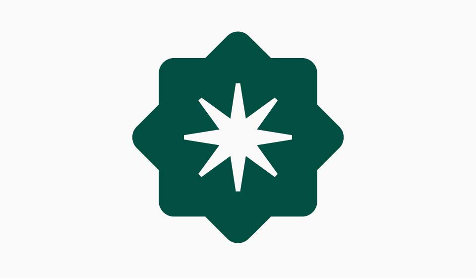 Martin’s Point brand medallion in dark green on a light grey background.