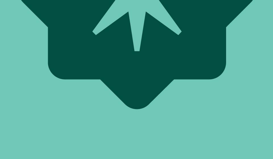 Lower portion of Martin’s Point brand medallion in dark green on a seafoam background.