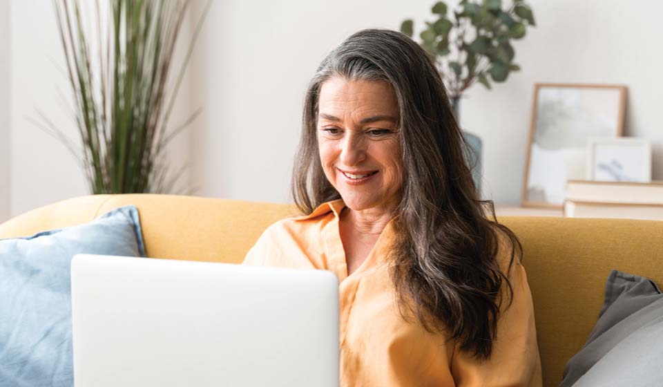 Woman using a laptop at home