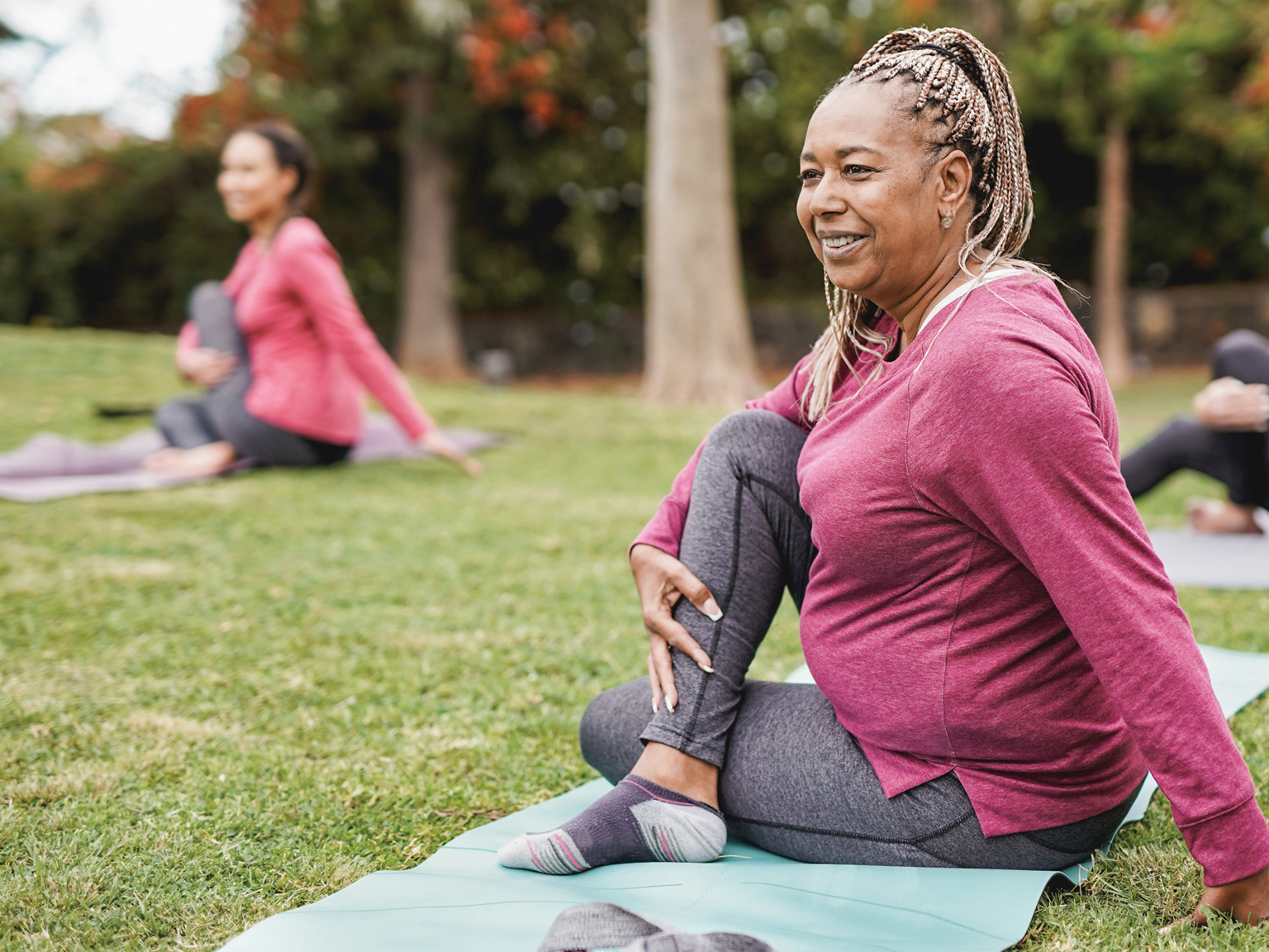 two females practicing yoga