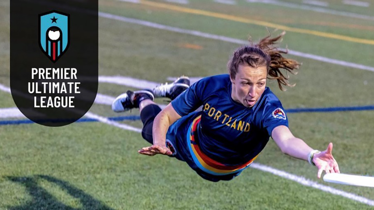 woman professional frisbee player diving for frisbee with premier ultimate logo
